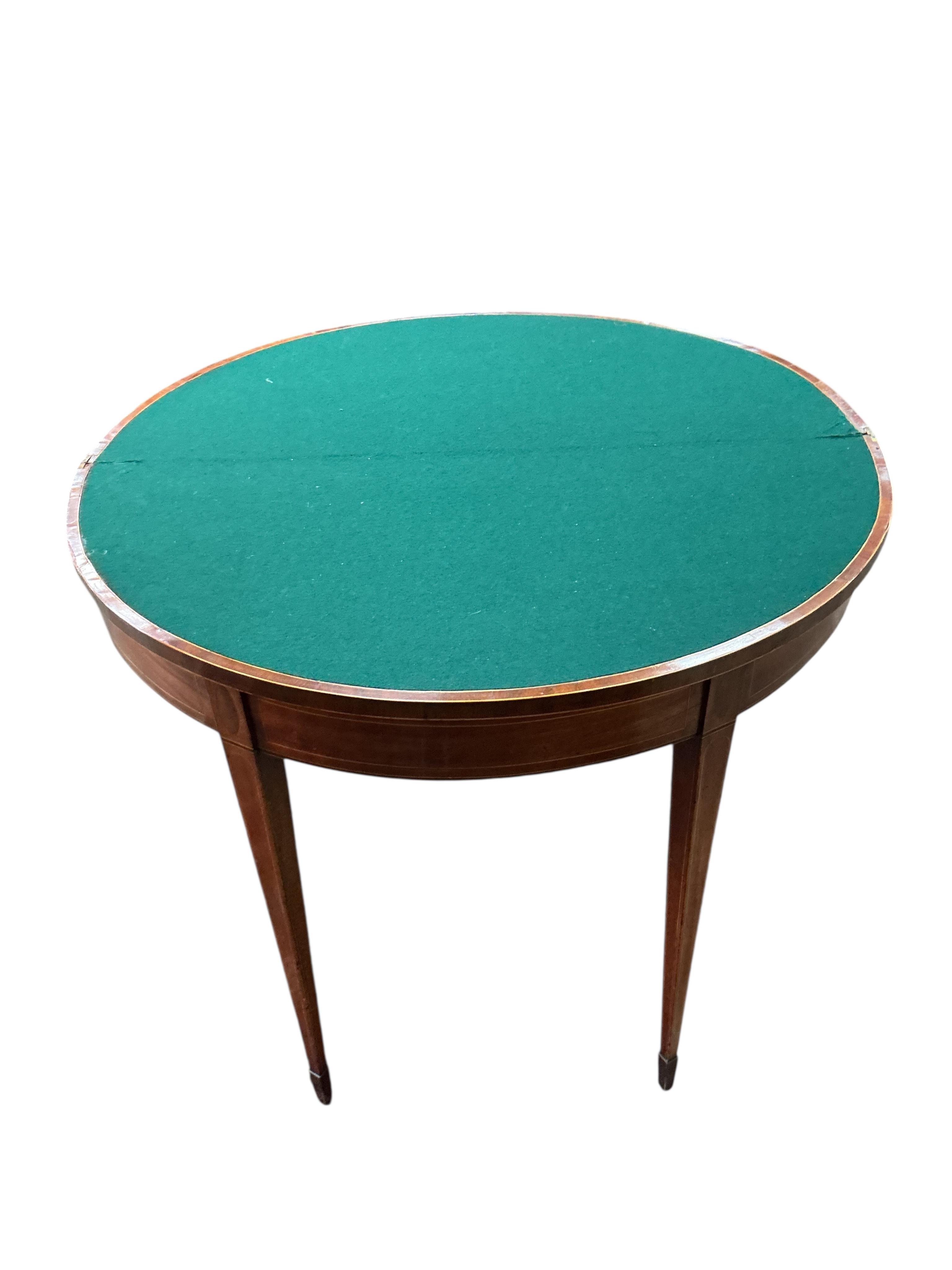 A George III tulip banded mahogany demi-lune folding card table, width 91cm, depth 45cm, height 74cm